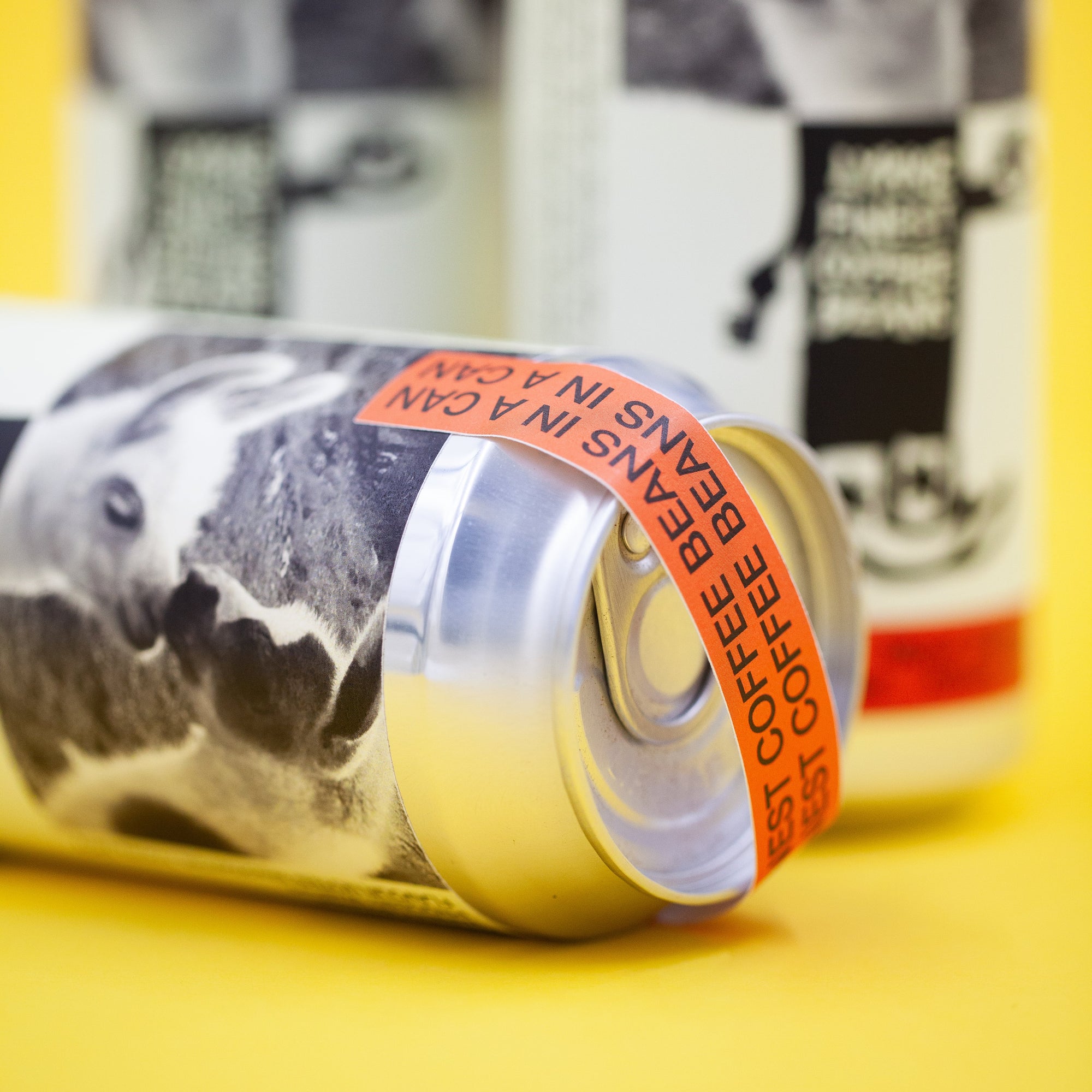 Close-up of a can of coffee with a yellow background