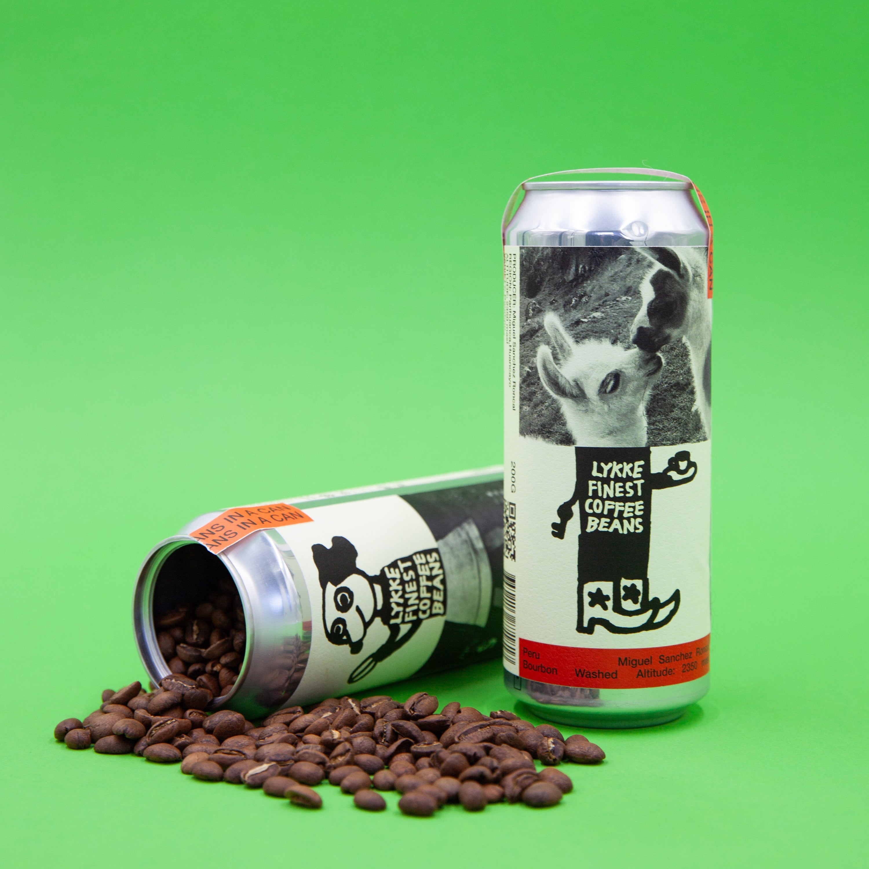 Two cans of 'Lykke Coffee Beans' with coffee beans on a green background